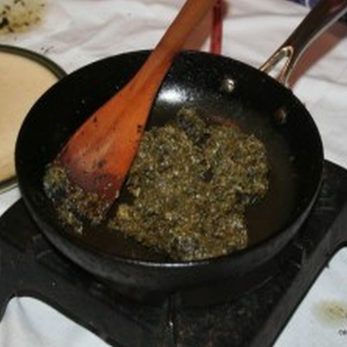 Dock Pudding being made in a frying pan